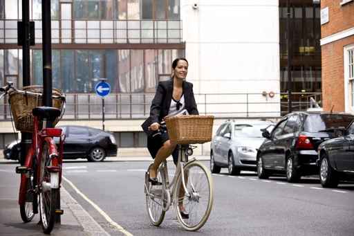 Girl riding bike in city